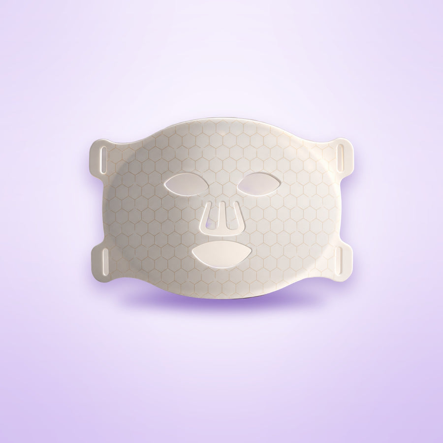 LED silicone face mask shown on a soft lavender background