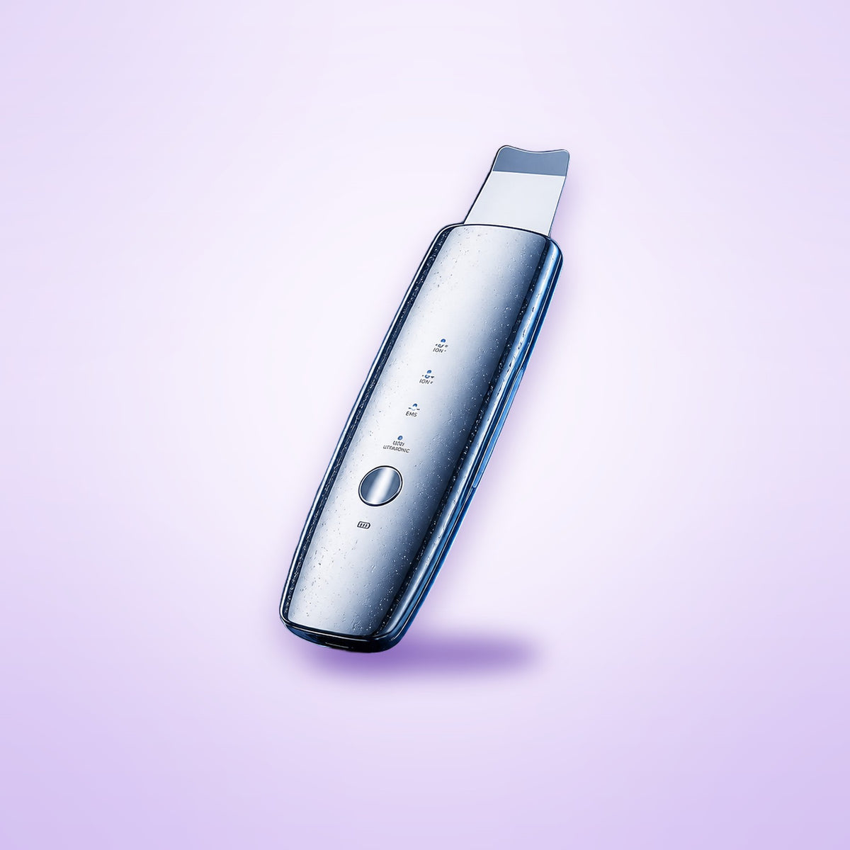 Ultrasonic skin spatula shown on a soft lavender background